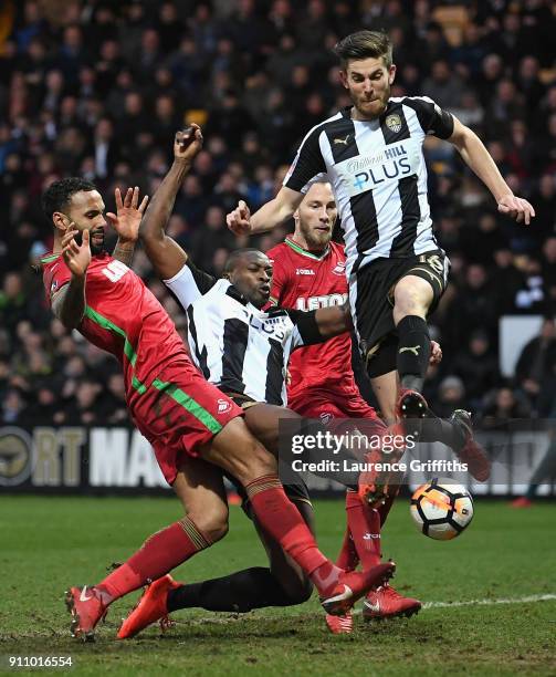 Shaun Brisley and Foluwashola Ameobi of Notts County get past the Swansea City defance during The Emirates FA Cup Fourth Round match between Notts...