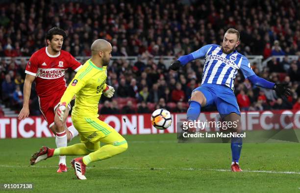 Jiri Skalak of Brighton and Hove Albion and Darren Randolph of Middlesbrough battle for the ball during The Emirates FA Cup Fourth Round match...