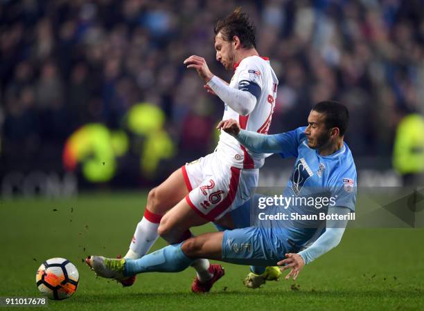 Rod McDonald of Coventry City tackles Alex Gilbey of Milton Keynes Dons during The Emirates FA Cup Fourth Round match between Milton Keynes Dons and...