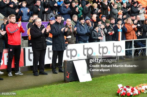 Blackpool manager Gary Bowyer and Charlton Athletic manager Karl Robinson applaud after laying wreaths in the goal mouth in front of the Armfield...