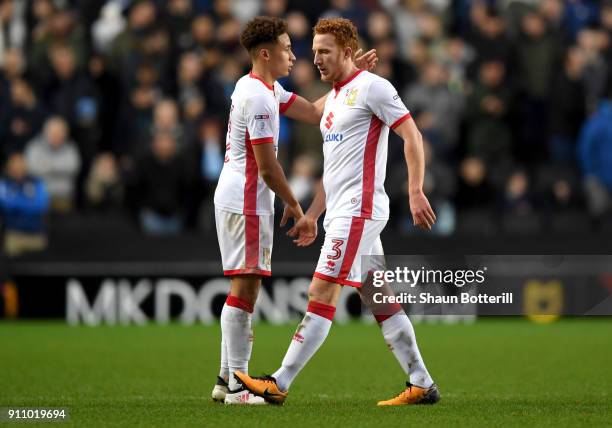 Dean Lewington of Milton Keynes Dons shakes hands with Marcus Tavernier of Milton Keynes Dons as he is subbed off during The Emirates FA Cup Fourth...