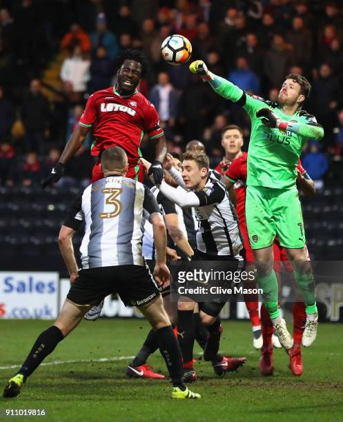 Adam Collin of Notts County clears from Wilfried Bony of Swansea City during The Emirates FA Cup Fourth Round match between Notts County and Swansea...
