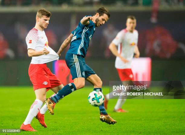 Leipzig´s forward Timo Werner and Hamburg´s defender Dennis Diekmeier vie for the ball during the German first division Bundesliga football match, RB...