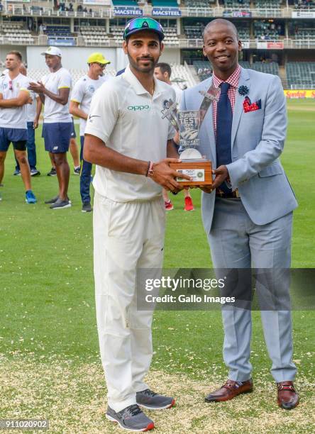 Bhuvneshwar Kumar receives his man of the match trophy during day 4 of the 3rd Sunfoil Test match between South Africa and India at Bidvest Wanderers...