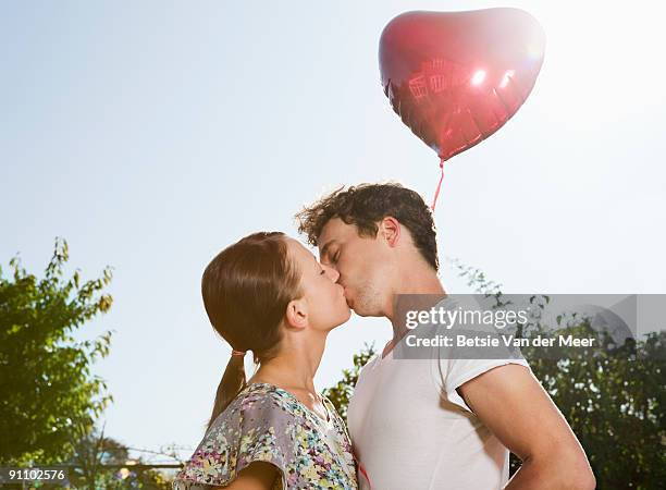couple kissing. - betsie van der meer stock pictures, royalty-free photos & images