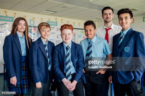 students and teacher - school uniform stock pictures, royalty-free photos & images