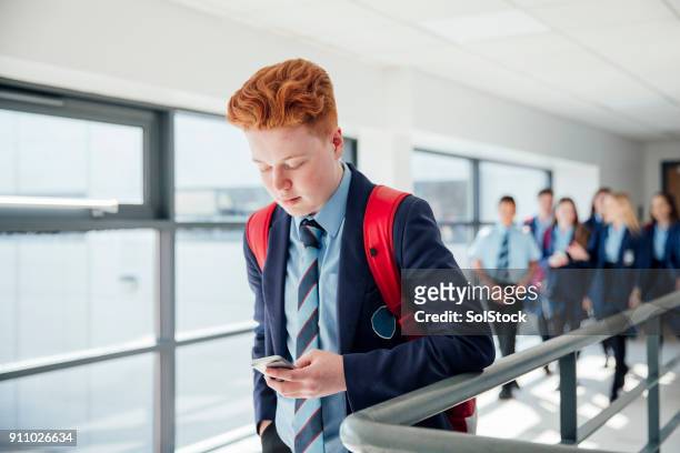 redhead male on phone - british culture walking stock pictures, royalty-free photos & images