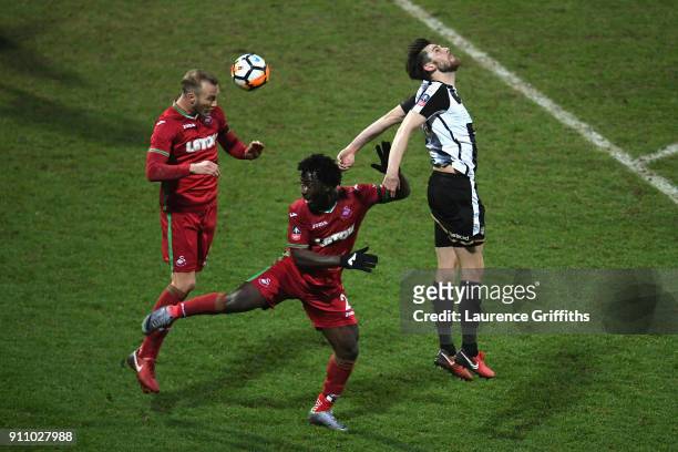 Shaun Brisley of Notts County battles with Wilfried Bony and Mike van der Hoorn of Swansea City during The Emirates FA Cup Fourth Round match between...