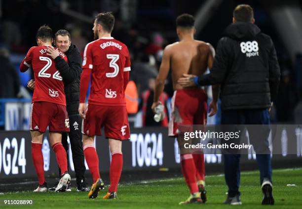 Steve Cotterill, Manager of Birmingham embraces Carl Jenkinson of Birmingham following The Emirates FA Cup Fourth Round match between Huddersfield...