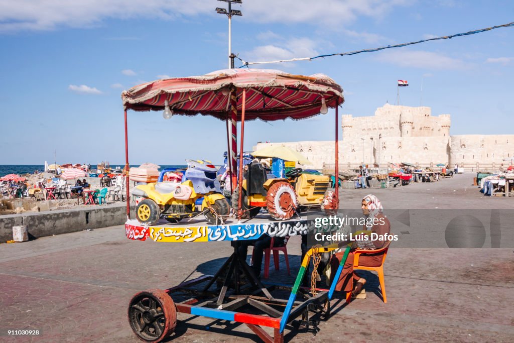 Small merry-go-round opposite Qaitbay fort.