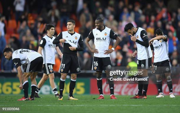 Valencia players look dejected after the La Liga match between Valencia and Real Madrid at Estadio Mestalla on January 27, 2018 in Valencia, Spain.