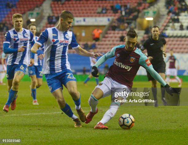 Sead Haksabanovic of West Ham United in action with Ryan Colclough of Wigan Athletic during The Emirates FA Cup Fourth Round match between Wigan...