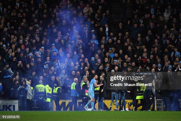 Fans invade the pitch during The Emirates FA Cup Fourth Round match between Milton Keynes Dons and Coventry City at Stadium mk on January 27, 2018 in...