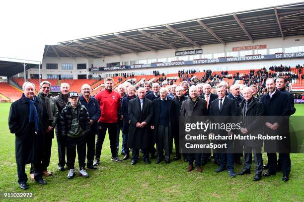 Blackpool manager Gary Bowyer and Charlton Athletic manager Karl Robinson pose with former Blackpool FC players after laying wreaths in the goal...