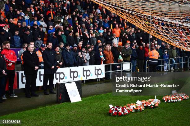 Blackpool manager Gary Bowyer and Charlton Athletic manager Karl Robinson look on after laying wreaths in the goal mouth in front of the Armfield...
