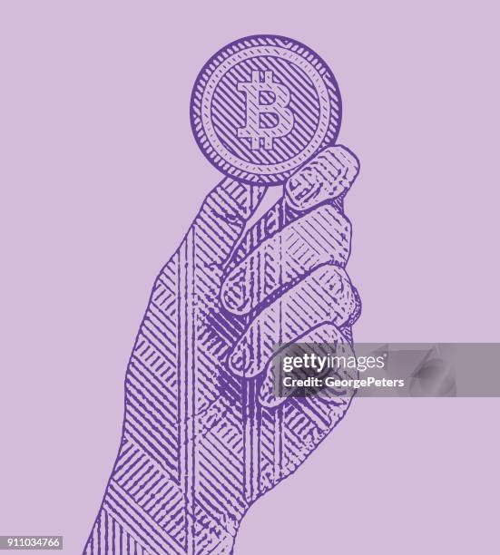 ultra violet engraving illustration of a hand holding a bitcoin - cryptocurrency stock illustrations