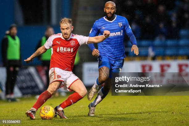 Fleetwood Town's Paddy Madden crosses under pressure from Gillingham's Scott Wagstaff during the Sky Bet League One match between Gillingham and...