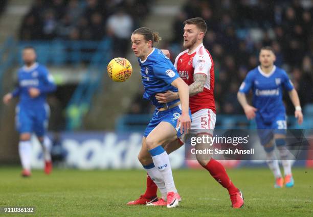 Tom Eaves of Gillingham is held back by Ashley Eastham of Fleetwood Town during the Sky Bet League One match between Gillingham and Fleetwood Town at...