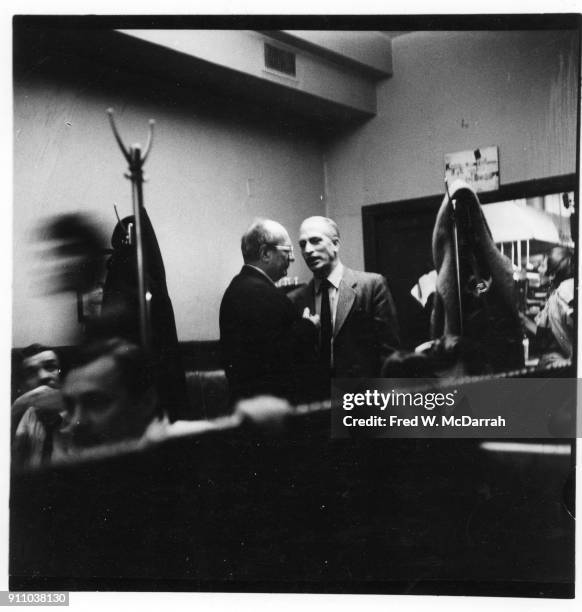 Latvian-born American painter Mark Rothko and sculptor Peter Grippi talk together at the Cedar Tavern, New York, New York, March 9, 1959.