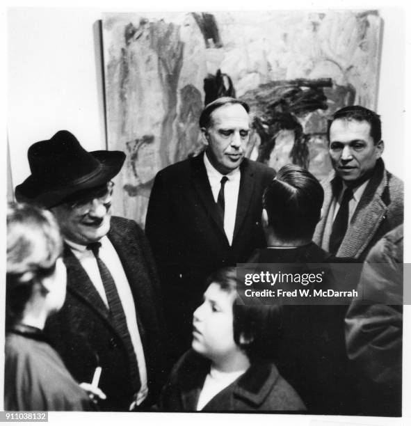 As Latvian-born American painter Mark Rothko talks with editor Rose Slivka , Canadian painter Philip Guston attends an exhibition of his work at...