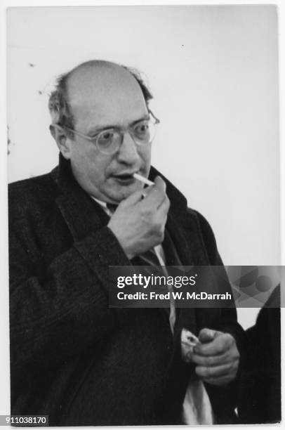 Latvian-born American painter Mark Rothko lights a cigarette as he attends an exhibition at Sidney Janis Gallery, New York, New York, March 6, 1961.