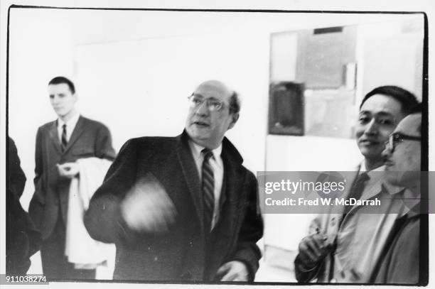 Latvian-born American painter Mark Rothko talks to unidentified others during an exhibition at Sidney Janis Gallery, New York, New York, March 6,...