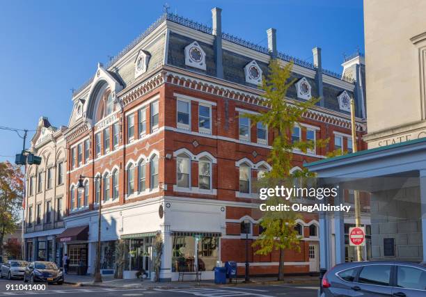 street with historic red brick building in downtown kingston, hudson valley, new york. - kingston stock pictures, royalty-free photos & images