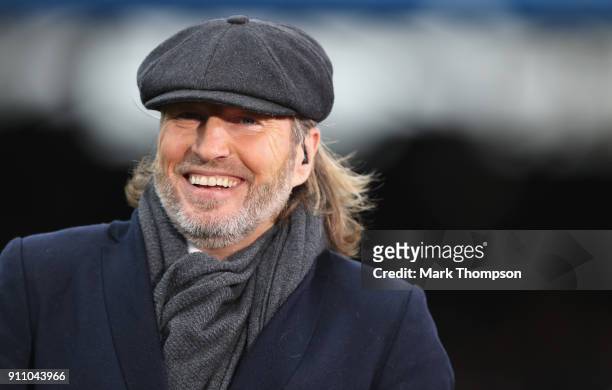 Football pundit and ex professional player Robbie Savage working during the Emirates FA Cup Fourth Round match between Peterborough United and...