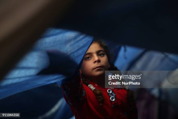 Palestinian children play inside their family's house North of Gaza City during a storm in Gaza Strip on January 27, 2018.