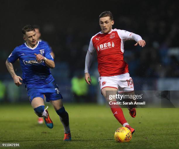 Conor McAleny of Fleetwood Town is tracked by Mark Byrne during the Sky Bet League One match between Gillingham and Fleetwood Town at Priestfield...