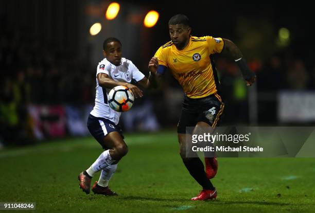 Joss Labadie of Newport County is challenged by Kyle Walker-Peters of Tottenham Hotspur during The Emirates FA Cup Fourth Round match between Newport...