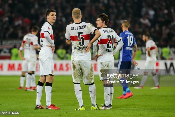 Marcin Kaminski of Stuttgart, Timo Baumgartl of Stuttgart and Benjamin Pavard of Stuttgart looks dejected after the Bundesliga match between VfB...