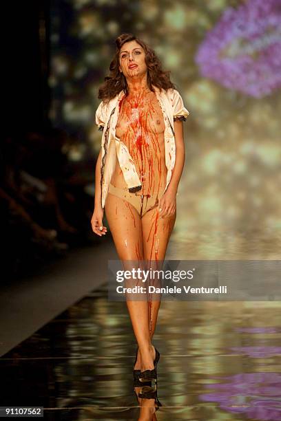 An actress performs during the Seduzioni Diamonds Valeria Marini fashion show at the Milano Fashion Center as part of Milan Womenswear Fashion Week...