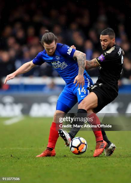 Jack Marriott of Peterborough United in action with Danny Simpson of Leicester City the FA Cup 4th Round match between Peterborough United and...