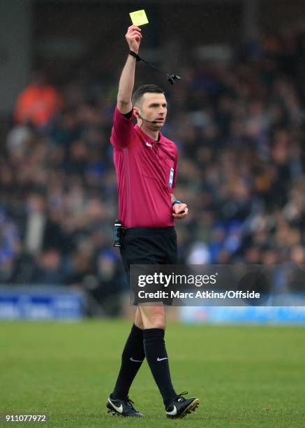 Referee Michael Oliver shows a yellow card during the FA Cup 4th Round match between Peterborough United and Leicester City at ABAX Stadium on...