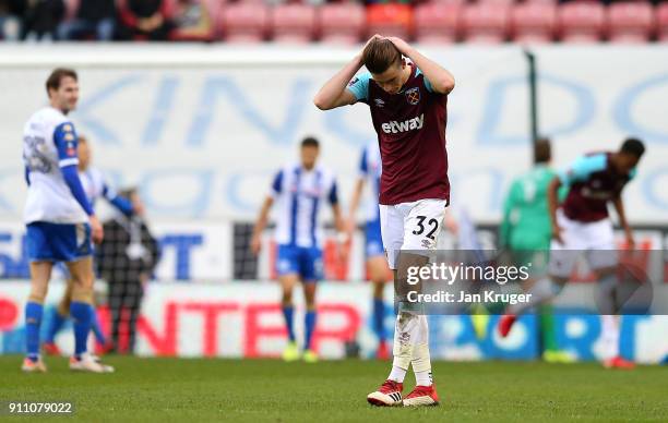 Reece Burke of West Ham United looks on dejected after seeing a shot at goal go wide during the Emirates FA Cup Fourth Round match between Wigan...