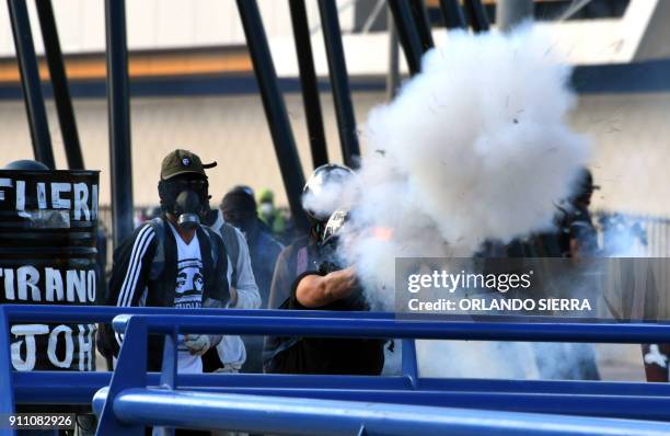 Honduran Opposition Alliance Against the Dictatorship supporters clash with army soldiers and riot police agents protesting against president Juan...