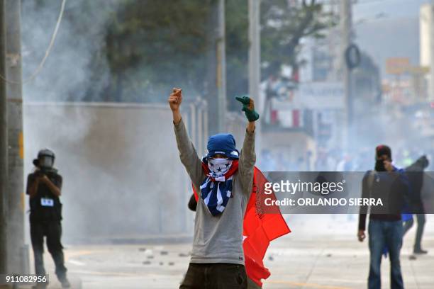 Honduran Opposition Alliance Against the Dictatorship supporters clash with army soldiers and riot police agents protesting against president Juan...