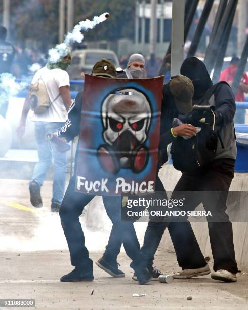 Honduran Opposition Alliance Against the Dictatorship supporters clash with army soldiers and riot police agents protesting against president Juan...