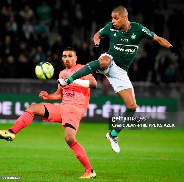 Caen's French defender Alexander Djiku vies with Saint-Etienne's French forward Kevin Monnet-Paquet during the French L1 football match between...