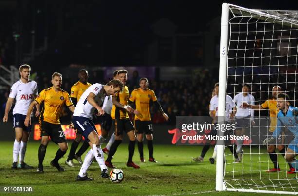 Harry Kane of Tottenham Hotspur scores his sides first goal during The Emirates FA Cup Fourth Round match between Newport County and Tottenham...