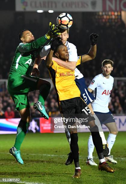 Shawn McCoulsky of Newport County competes for a header with Michel Vorm and Jan Vertonghen of Tottenham Hotspur during The Emirates FA Cup Fourth...