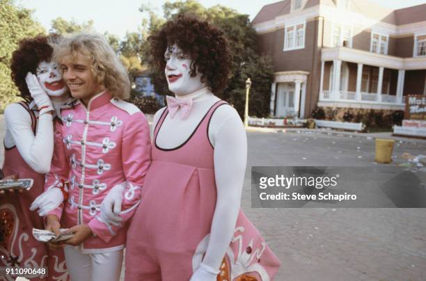 Actor/musician Peter Frampton , with two unidentified actors in clown costumes, on the set of their film 'Sgt Pepper's Lonely Hearts Club Band' , Los...