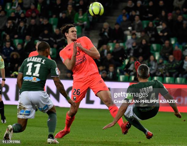 Saint-Etienne's Brazilian midfielder Gabriel Antunes Da Silva and Saint-Etienne's French defender Loic Perrin vie for the ball with Caen's Croatian...