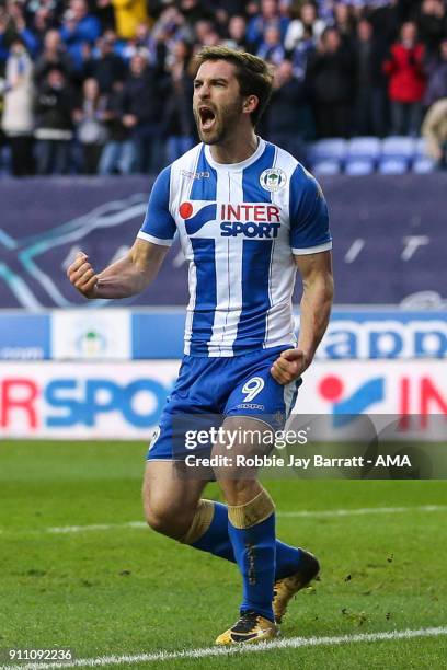 Will Grigg of Wigan Athletic celebrates after scoring a goal to make it 2-0 during the The Emirates FA Cup Fourth Round match between Wigan Athletic...