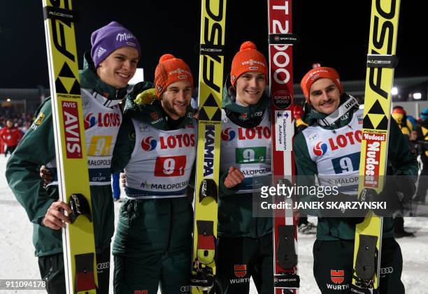 Germany's team Andreas Wellinger,Markus Eisenbichler, Stephan Leyhe and Richard Freitag pose for a picture after competing in the team competition of...