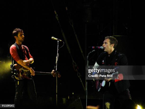 Guy Berryman and Chris Martin of Coldplay perform on stage at Wembley Stadium on September 18, 2009 in London, England.