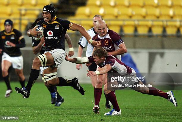 Victor Vito of the Lions is tackled by Scott Cowan of Southland during the Air New Zealand Cup Ranfurly Shield match between Wellington and Southland...