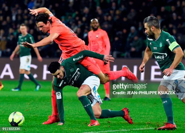 Saint-Etienne's French midfielder Remy Cabella vies with Caen's Croatian forward Ivan Santini during the French L1 football match between...