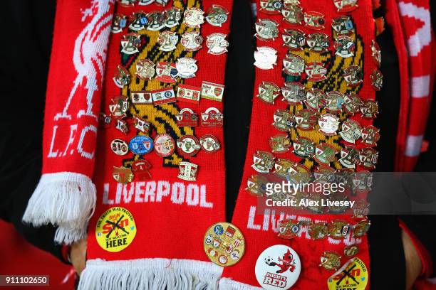 Liverpool badges are pictured on a fans scarf during The Emirates FA Cup Fourth Round match between Liverpool and West Bromwich Albion at Anfield on...